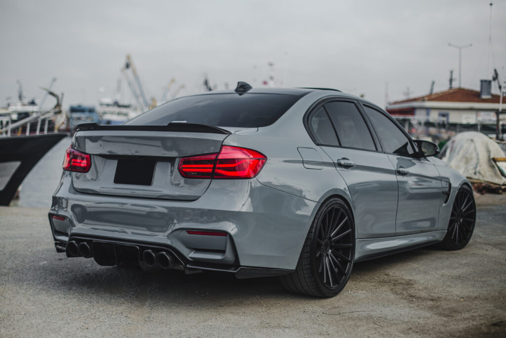 silver-sedan-with-red-lights-parked-port