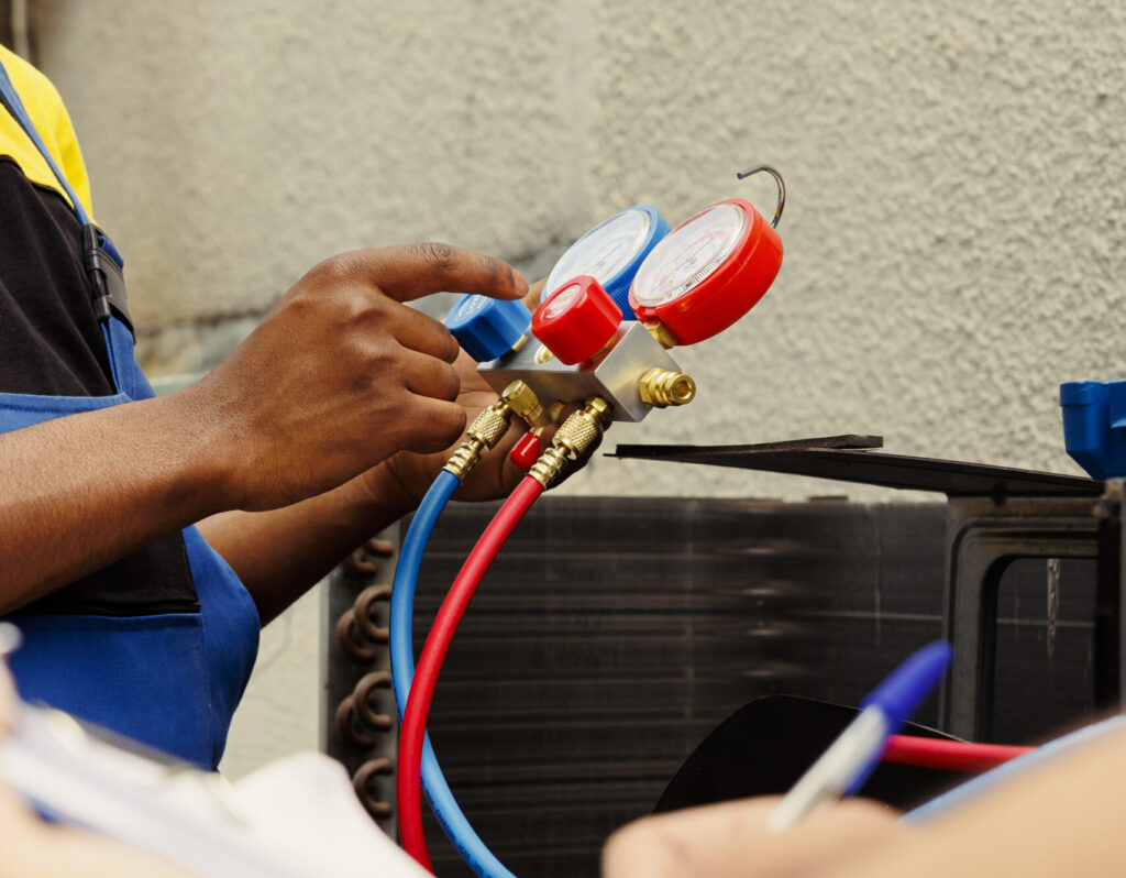 Workers refilling air conditione freon